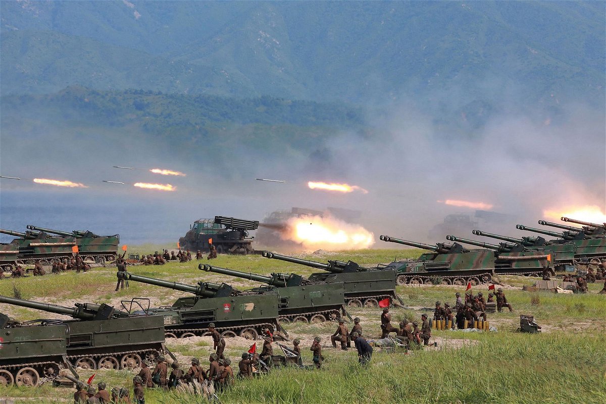 <i>KCNA/KNS/AFP/Getty Images</i><br/>Rockets are launched by Korean People's Army (KPA) personnel during a target strike exercise at an undisclosed location in North Korea.
