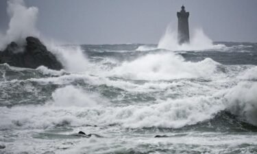 Waves crashing on the Phare du Four in Porspoder
