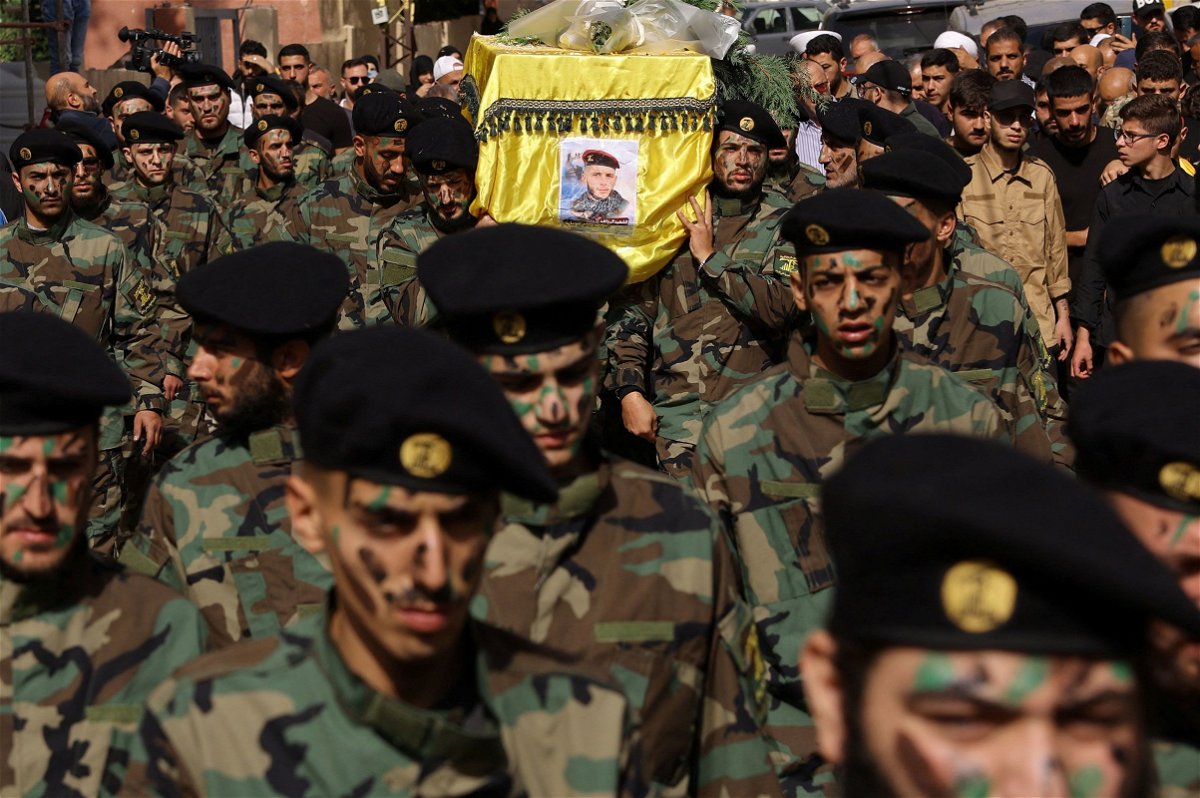 <i>Amr Alfiky/Reuters</i><br/>Members of Hezbollah carry the coffin of Hezbollah member Abbas Shuman