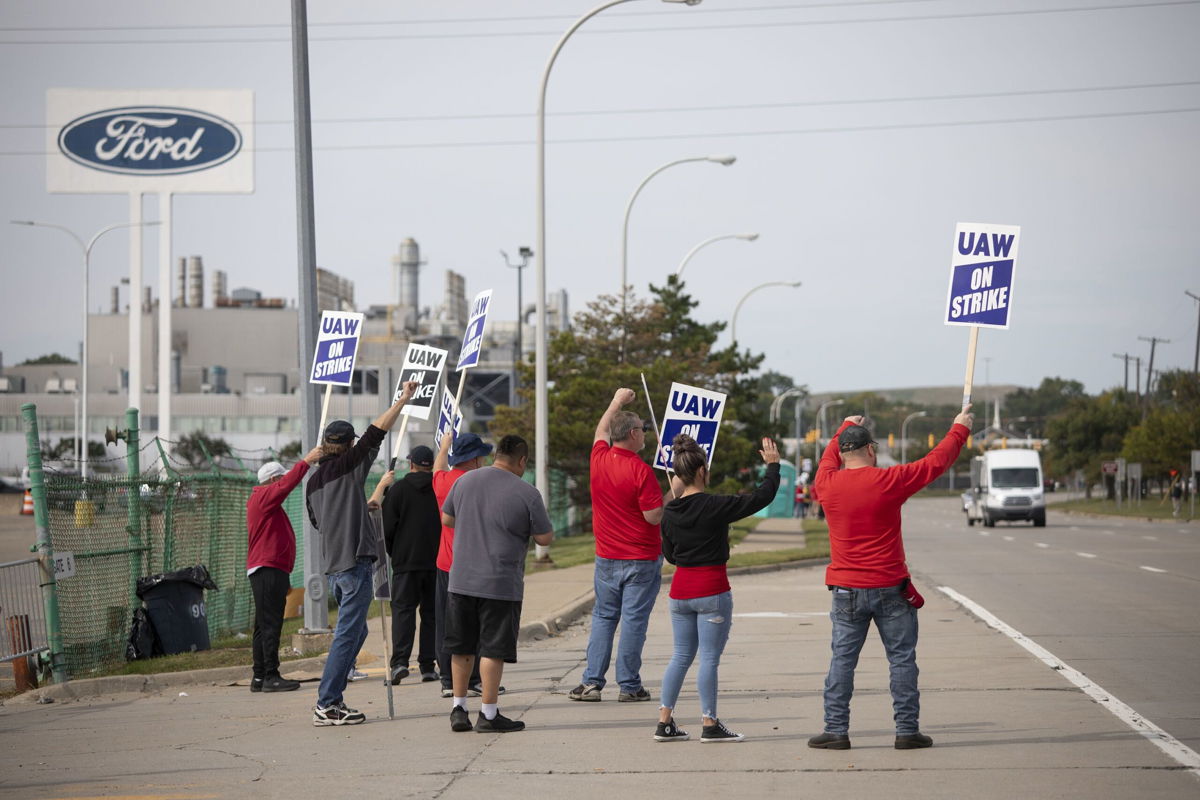 <i>Bill Pugliano/Getty Images</i><br/>United Auto Workers members strike at the Ford Michigan Assembly Plant on September 16