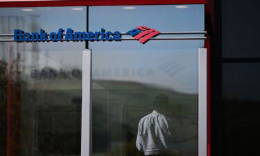 A customer withdraws money from an automatic teller machines (ATM) inside a Bank of America Corp. branch in New York