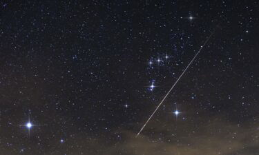 A meteor from one of the Taurid meteor showers creates a bright streak across the night sky over Brkini