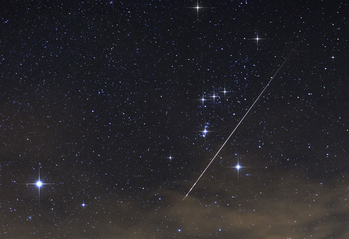 <i>Marko Korosec/Solent News/Shutterstock</i><br/>A meteor from one of the Taurid meteor showers creates a bright streak across the night sky over Brkini