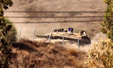 An Israeli army battle tank moves at a position near the border with the Gaza Strip in southern Israel on November 3