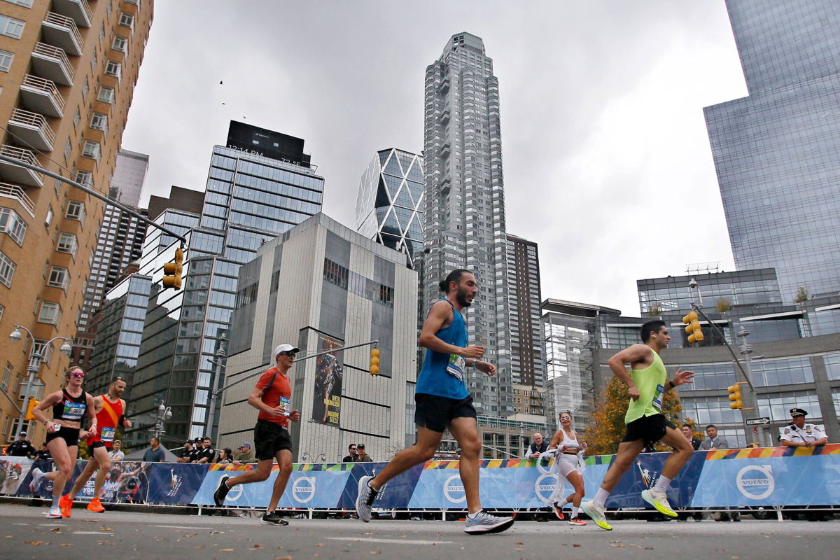 <i>Leonardo Munoz/VIEWpress/Getty Images</i><br/>People participate in the 2022 TCS New York City Marathon.