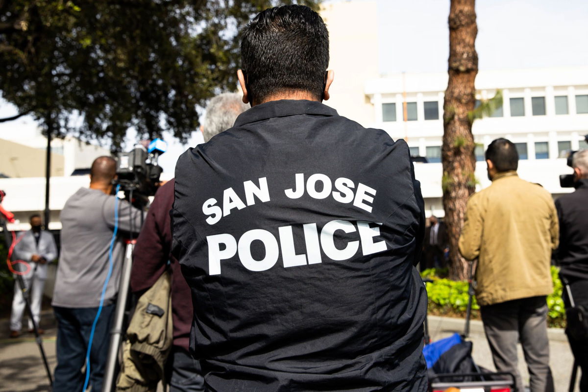 <i>Randy Vazquez/MediaNews Group/The Mercury News/Getty Images</i><br/>A person wears a San Jose Police jacket during a news conference outside the San Jose Police department in San Jose
