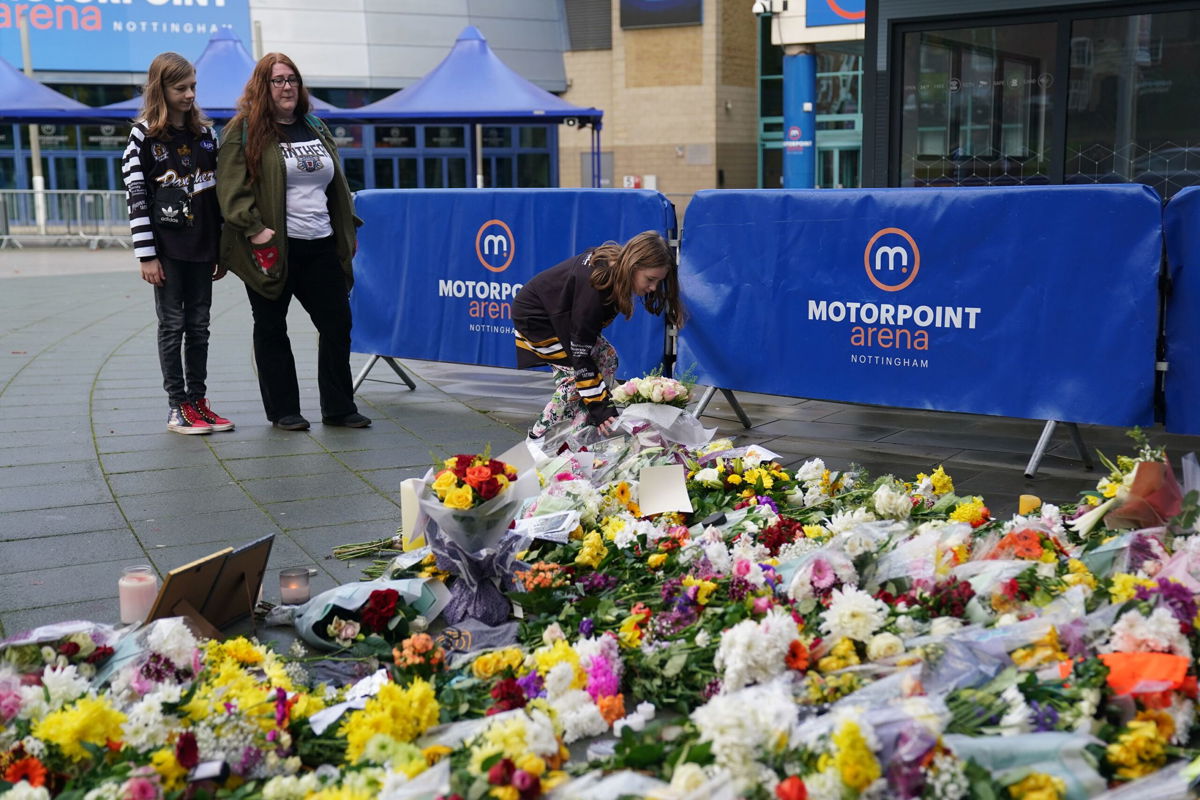 <i>Jacob King/PA Images/Getty Images</i><br/>People lay flowers and messages in tribute to Nottingham Panthers' ice hockey player Adam Johnson.