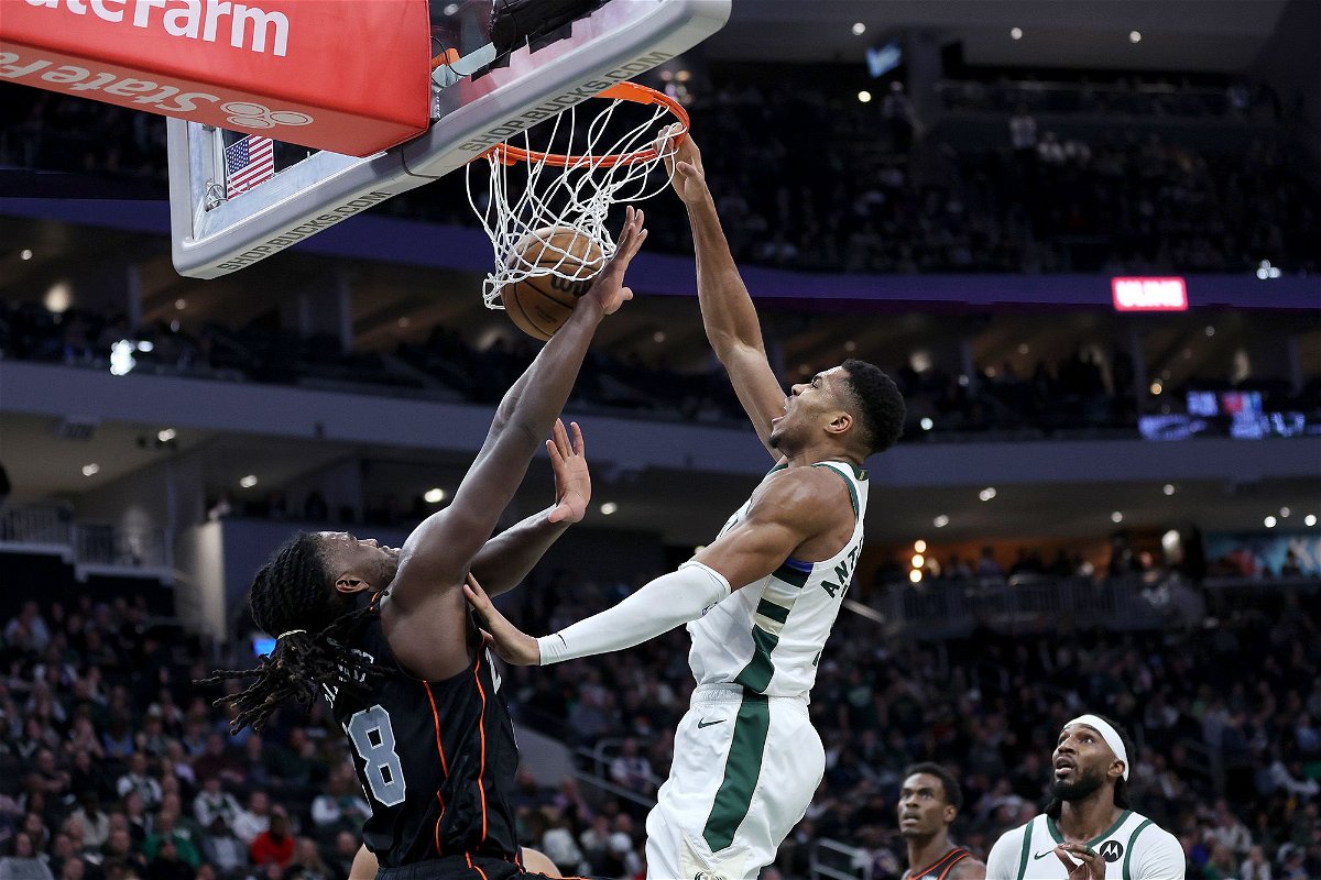 <i>Stacy Revere/Getty Images</i><br/>Giannis Antetokounmpo sits courtside after being told to leave the game.
