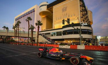 Red Bull Racing driver Sergio Perez drives on a track on the Las Vegas Strip during the F1 Las Vegas launch party in 2022.