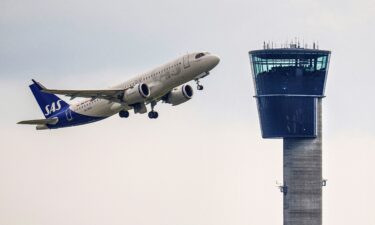 An SAS plane takes off from Copenhagen Airport. Denmark’s government on November 9 proposed imposing an average tax of 100 Danish krone ($14.35) on air travel to help finance a green transition of the airline industry that will enable all domestic flights to use 100% sustainable fuels by 2030.