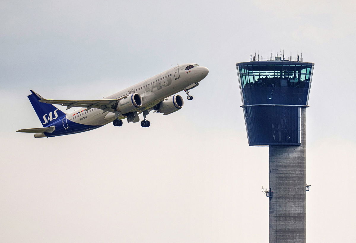 <i>Liselotte Sabroe/Ritzau Scanpix/AFP/Getty Images</i><br/>An SAS plane takes off from Copenhagen Airport. Denmark’s government on November 9 proposed imposing an average tax of 100 Danish krone ($14.35) on air travel to help finance a green transition of the airline industry that will enable all domestic flights to use 100% sustainable fuels by 2030.