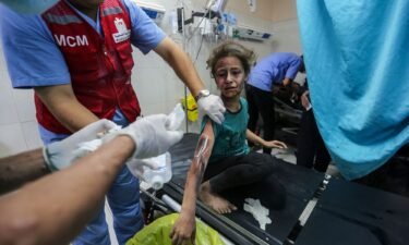 Israeli tanks have surrounded a Gaza hospital as strikes reportedly hit the vicinity of other healthcare facilities in the Strip. A Palestinian child is pictured receiving treatment at Nasser Medical hospital in Gaza
