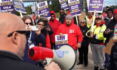 Members of the United Auto Workers union at Ford have ratified their labor deal and by a larger margin of approval than members at General Motors. Pictured are workers picketing outside of the Ford Assembly plant last month during the UAW strike.