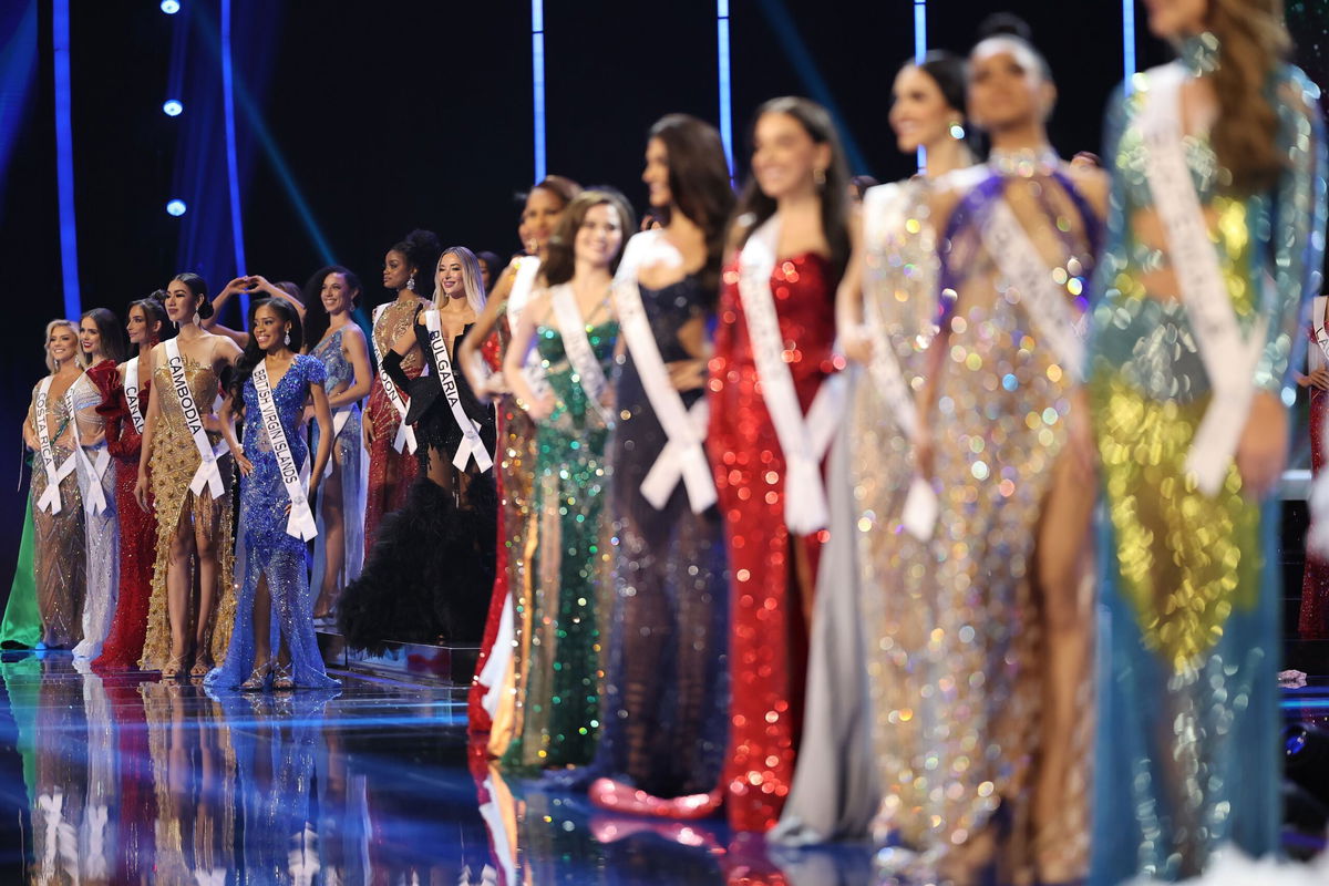 <i>Hector Vivas/Getty Images</i><br/>2023 Miss Universe contestants pose on stage during the evening gown presentation during the pageant's preliminary competition.