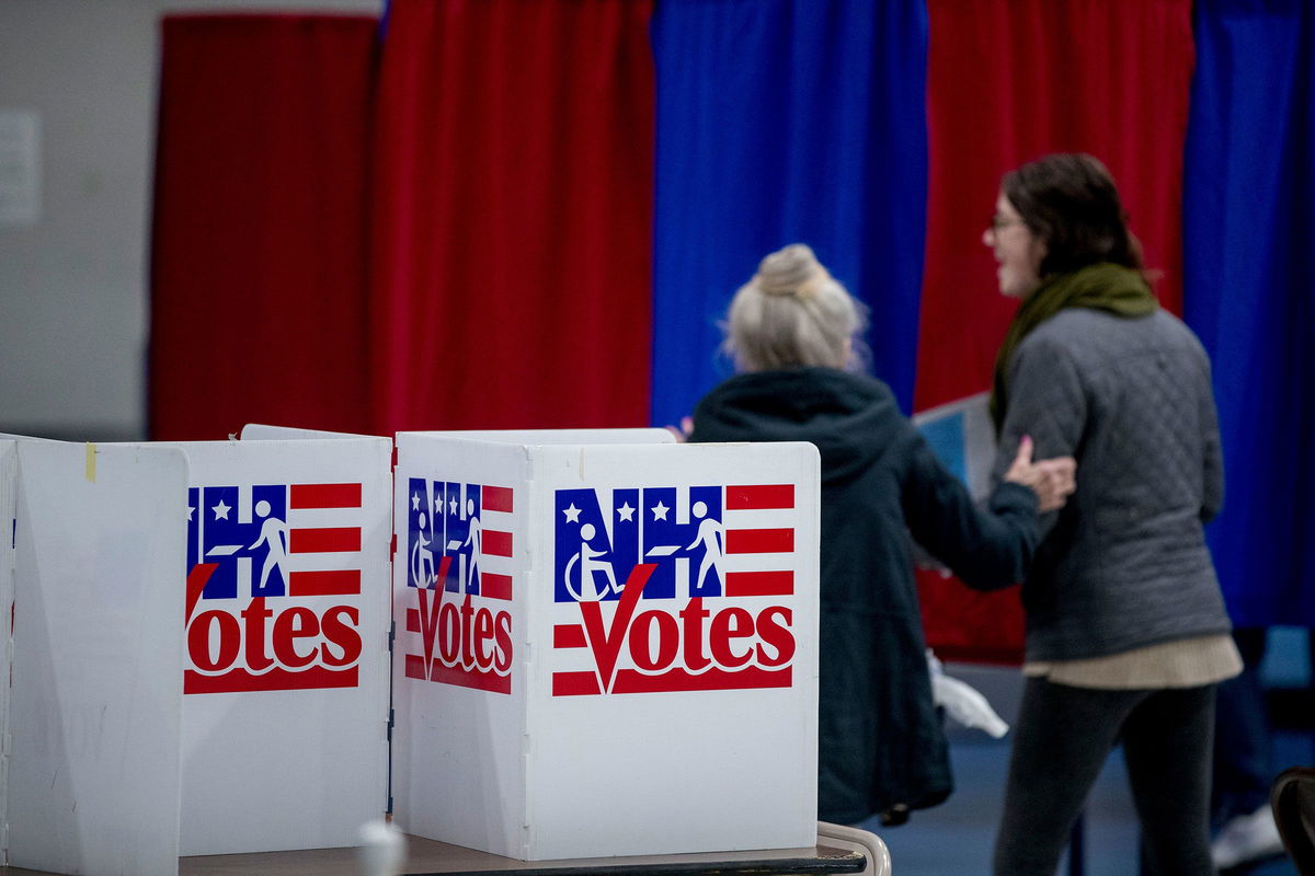 <i>Andrew Harnik/AP</i><br/>Residents arrive to vote in the New Hampshire primary at a polling location in Manchester on February 11