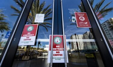 Signs are posted on the door of a closed unionized Starbucks Coffee in Anaheim
