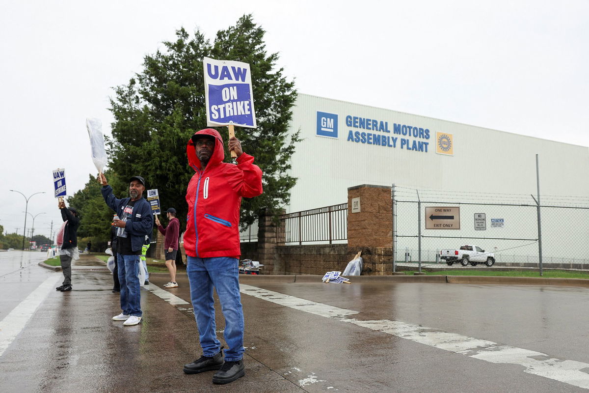 <i>James Breeden/Reuters</i><br/>United Auto Workers members strike at a General Motors assembly in October as the rank-and-file membership have ratified the deal