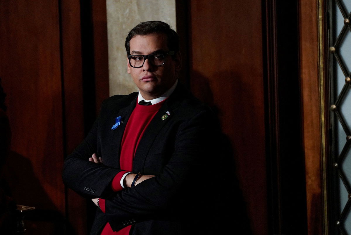 <i>Elizabeth Frantz/Reuters/File</i><br/>Rep. George Santos stands alone at the back of the House chamber during a second round of voting at the US Capitol in Washington