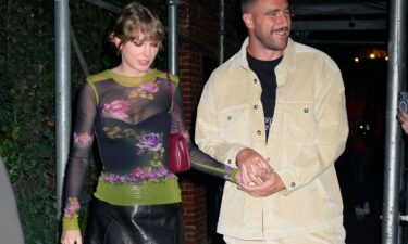 (From left) Taylor Swift and Travis Kelce holding hands in New York City in October.