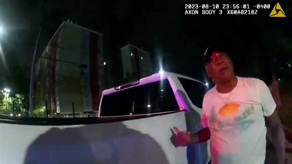 <i>Atlanta Police</i><br/>This image from bodycam video provided by the Atlanta Police Department shows Johnny Hollman Sr. speaking with Officer Kiran Kimbrough on August 10.