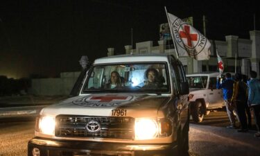 A Red Cross convoy carrying Israeli and foreign hostages heads to Egypt from the Gaza Strip on Sunday.