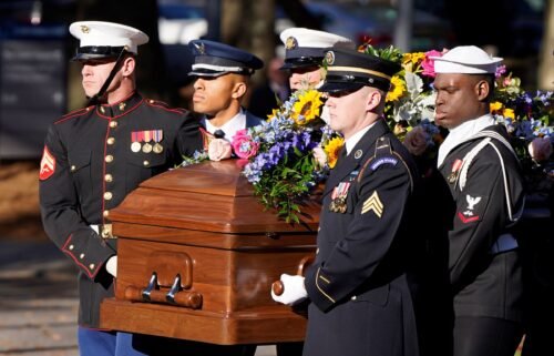 A military team carries the casket of former first lady Rosalynn Carter upon arrival at the Jimmy Carter Presidential Library and Museum