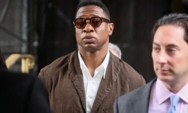 Jonathan Majors is pictured leaving the New York State Supreme Court in New York City in June. His assault and harassment trial case is set to begin on Wednesday.