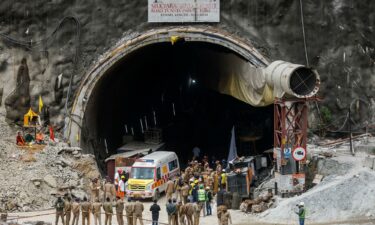 Ambulances wait in line to enter a tunnel where rescue operations are underway to rescue trapped workers in Uttarakhand