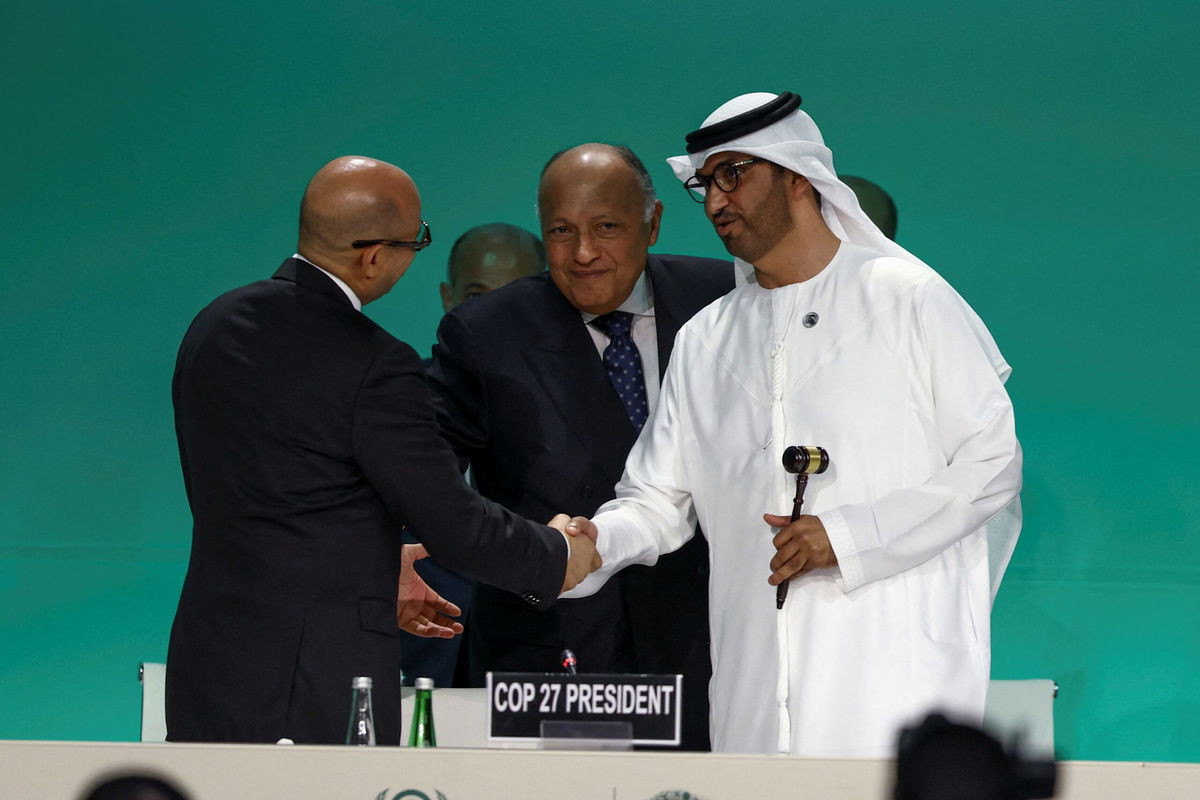 <i>Amr Alfiky/Reuters</i><br/>COP28 President Sultan Ahmed Al Jaber holds a gavel next to Egyptian Foreign Minister and COP27 President Sameh Shoukry during the COP28 opening in Dubai on Thursday.