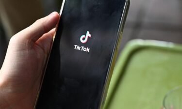 The logo of the social media platform TikTok is displayed on a mobile phone in Hanoi on October 6. A judge dismissed a lawsuit filed by the state of Indiana against TikTok accusing the company of making false claims about the safety of user data and age-appropriate content.