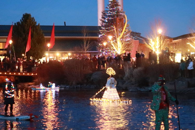 It's as the sun sets that the Holiday Lights Paddle Parade takes on a special glow on the river