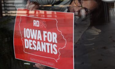 A campaign sign is placed on a door at the River Center in Des Moines