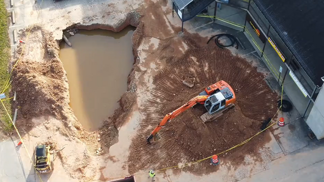 <i>WLOS</i><br/>The sinkhole in front of a business plaza on Sardis Road as seen from above.