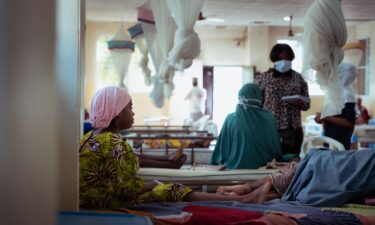 A vial of diphtheria anti-toxin is prepared by a doctor at the treatment center in Kano