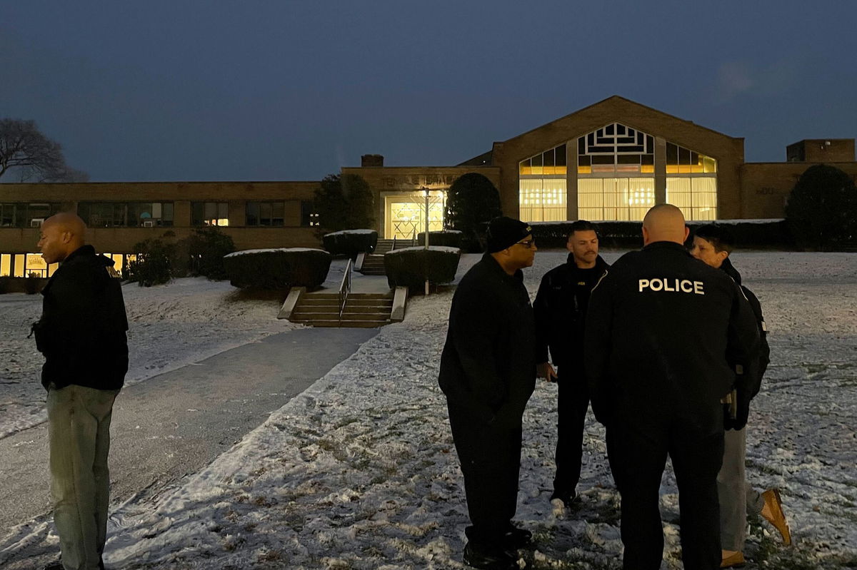 <i>Maysoon Khan/AP</i><br/>Police officers gather outside Temple Israel in Albany