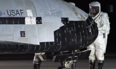 An X-37B Orbital Test Vehicle sits on the runway during post-landing operations at Vandenberg Air Force Base near Lompoc