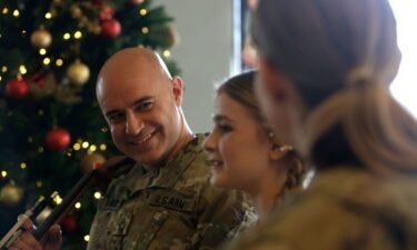 Army Master Sgt. Benjamin Wensel smiles at his daughter