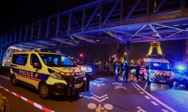 French police secure the Bir Hakeim bridge after the attack in Paris on December 2.