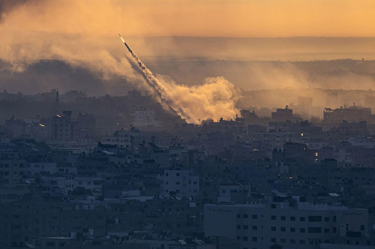 <i>Fatima Shbair/AP</i><br/>Rockets are fired toward Israel from the Gaza Strip