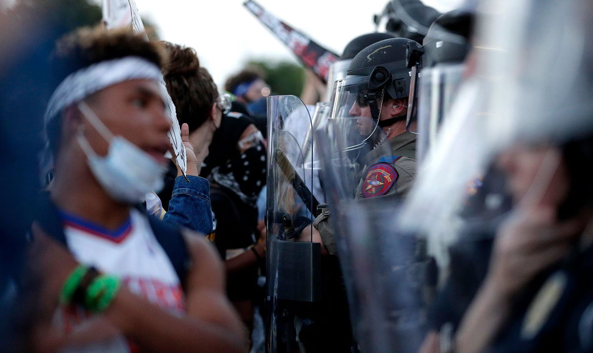 <i>Eric Gay/AP/File</i><br/>Demonstrators face Austin Police Department officers as they gather in downtown Austin