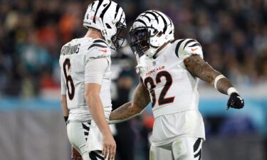 Jake Browning and Trayveon Williams celebrate a Cincinnati Bengals touchdown against the Jacksonville Jaguars during the third quarter at EverBank Stadium.