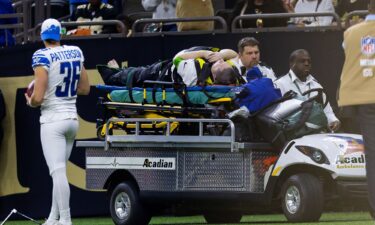 Nick Piazza is stretchered away after suffering an injury following a collision with New Orleans Saints running back Alvin Kamara.