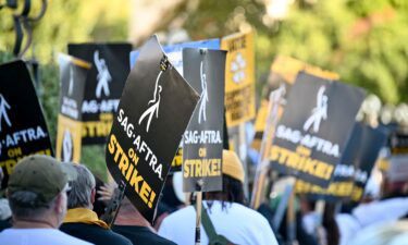 Members of SAG-AFTRA walk in protest at the SAG-AFTRA Strike at Walt Disney Studios on November 1