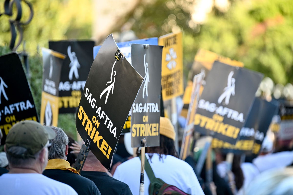 <i>Michael Buckner/Variety/Getty Images</i><br/>Members of SAG-AFTRA walk in protest at the SAG-AFTRA Strike at Walt Disney Studios on November 1