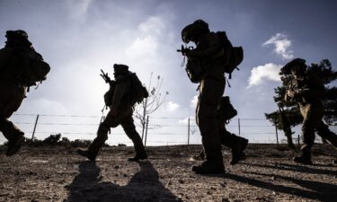 Israeli soldiers patrol near the Gaza border as the clash between the Israeli army and Palestinian factions continues in Nir Oz