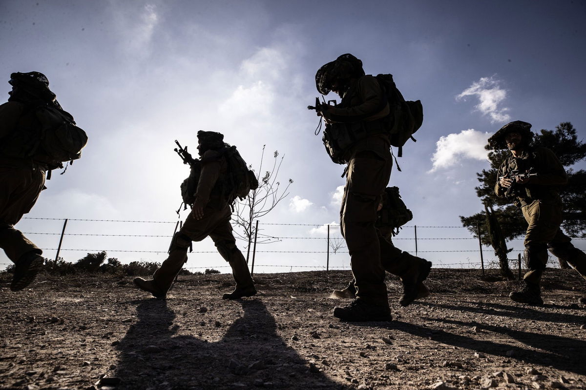 <i>Mostafa Alkharouf/Anadolu via Getty Images</i><br/>Israeli soldiers patrol near the Gaza border as the clash between the Israeli army and Palestinian factions continues in Nir Oz