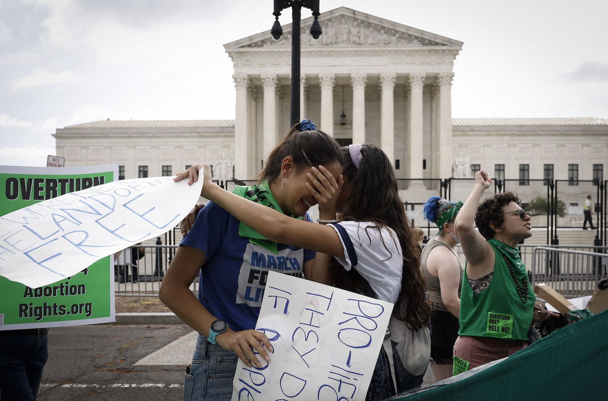 <i>Anna Moneymaker/Getty Images</i><br/>Abortion rights activists Carrie McDonald and Soraya Bata react to the Dobbs v Jackson Women's Health Organization ruling which overturns the landmark abortion Roe v. Wade case in front of the U.S. Supreme Court on June 24