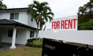 A "for rent" sign is posted in front of a home on December 12. The median asking rent in November declined 2.1% from a year before to $1