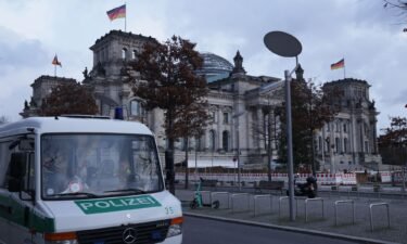 A police van outside Germany's parliament is pictured. Four alleged Hamas members suspected of plotting terror attacks on European soil have been arrested by German and Dutch authorities