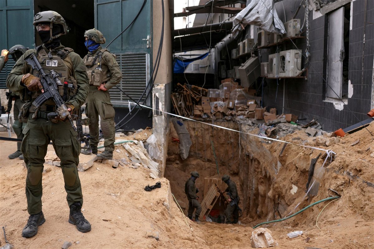 <i>Victor R. Caivano/AP</i><br/>An Israeli soldier stands in an underground tunnel in Gaza City on November 22.